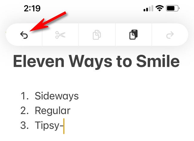 اضغط على زر تراجع في شريط تحرير آيفون.